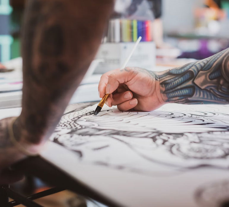 Tattoo Artist Making a Sketch